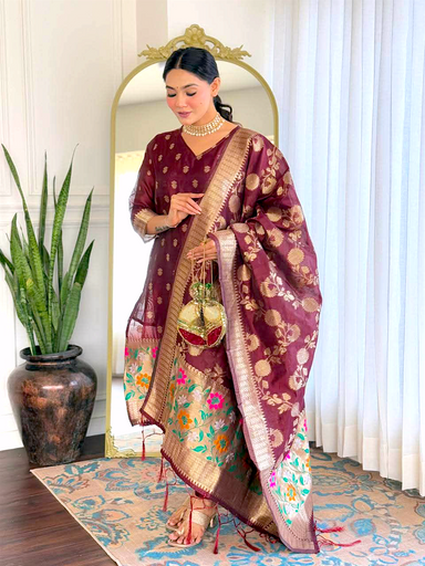 Mehroon  banarasi silk suit with havey floral border design 