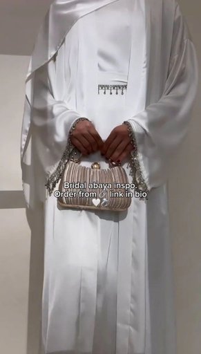 In Frame : SAFFIA DOUBLE SHRUG LACE ABAYA (swipe for more)